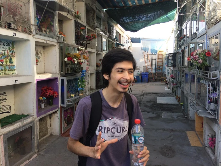 This is Tomas, life long citizen of Arica, Chile's northern most city near the border of Peru. Tomas is 18 and we met at the MB2 Teatro where he takes acting classes. On this day he has offered to walk with me through the city in search of bookstores. His classmate joins us. They are both studying to be English teachers at the university. However it is 3pm and here many businesses have a siesta from now until 5, so our search for an open bookstore is in vain. Instead we wander without a destination and end up at the city cemetery where Tomas happens to work occasionally as a tour guide. He tells me that he also performs a monthly gig, his favorite role to play, as an early 20th century street lamp lighter. Some onlookers he says come up
to him bewildered and demand an explanation  but what he likes better, what excites him most, is the older people who play along, some who remember that person he's bringing back and recall to him what he was actually like. At the cemetery he tells us about some notable figures who have taken up residence there including the notorious Francis Drake, a British pirate who circumnavigated the globe and faked his own death multiple times to escape capture. He died of dysentery and was supposedly buried at sea, but has a symbolic tomb here. Tomas says that seeing ghosts here is rare, that he has spent many hours here alone waiting and hasn't seen one. My high school Latin teacher proposed once that one can learn a lot about a place by seeing how they keep their dead. I think the same is true about a places bookstores even though many people don't use them anymore. Perhaps it's totally arbitrary that I've seen Walter Scott's Ivanhoe sold on the street here in Arica at least 3 times. When I mention the book to Tomas he's never heard of it (I've also never read it but I remember a classmate giving a book report on it once). Nonetheless I immediately think of the mountain which dominates the skyline, see a medieval Chilean knight ascending it, and wonder what kind of imaginary a landscape like this one produces. Will people even have imaginations soon? Tomas points to the tomb of a woman whose name I write on my hand and later wash off ab
