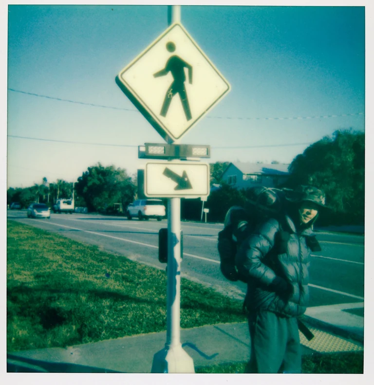 On view at The Front this Saturday & Sunday from 12 to 5 :

Christopher Givensâ photo series âTinoâs Pilgrimageâ is part of the current group exhibition Overtones of Extraction curated by Elliott Stokes ( )

To walk is to embrace simplicity, to shed the superfluous, and to confront the essence of what one is. As the noise of our lives increases, walking can be both a grounded meditation and an act of resistance against corrosive modern life.

In October of 2024, my friend Tino Park () began walking from Queens, NY towards the southernmost point of the continental United States. The 2,080-mile journey would take him 108 days. His manifesto, Migrational Pilgrimage, had three simple points:

1. I will walk on foot.
2. I will disconnect from all digital devices and media inputs except for the purpose of maps.
3. I will sleep and stay outdoors throughout the entire trip.

In these rules, he sought clarity and release from external noise. A psycho-spiritual detox. Basic movement from point A to B to C. His rhythms would be dictated by nothing but the journey. He had a sleeping bag but no tent and it was hard to sleep on nights when it froze or rained. He read Carl Saganâs Cosmos and wrote in a journal. He moved through highway shoulders, pinewoods, empty beaches, parking lots, across ditches, encountered vivid figures in his dreams, saw numberless dead animals, met strangers of all kinds, and walked by himself all day long.

Tino chose to engage with the world at a human pace. The physical labor of walking aligns with the spiritual labor of transforming oneself via a process. Walking between worlds of exterior and interior, real and imagined, the pilgrim is a bridge across which revelations might occur. Their migration inevitably leading to the core questions of any lifetime such as what of me is actually mine, or, more simply who am i now ?

Artist bio:
Christopher Givens was born in Monroe, Louisiana. He studied film at UNO in the first years after Katrina. Since 2020, he has been developingÂ The ABC Triptych ( ) a set of 3 feature films exploring synchronicity, perception, and spiritual transformation.